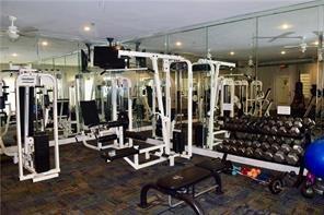 exercise room featuring ceiling fan