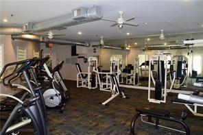 exercise room with ceiling fan