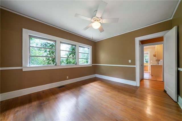 1276 Lanier Blvd NE, Atlanta, GA 30306 - unfurnished room featuring baseboards, crown molding, light wood-style floors, and ceiling fan