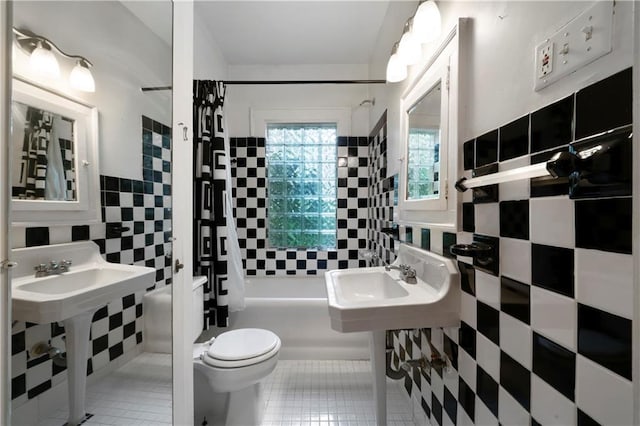 1276 Lanier Blvd NE, Atlanta, GA 30306 - full bathroom featuring tile walls, shower / bath combo, toilet, tile patterned flooring, and a sink
