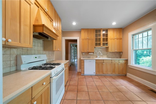 1276 Lanier Blvd NE, Atlanta, GA 30306 - kitchen featuring white appliances, premium range hood, light countertops, backsplash, and a sink