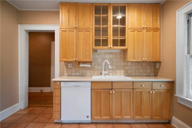 1276 Lanier Blvd NE, Atlanta, GA 30306 - kitchen with white dishwasher, a sink, baseboards, decorative backsplash, and light countertops