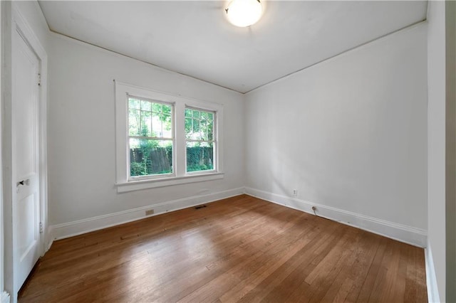 1276 Lanier Blvd NE, Atlanta, GA 30306 - unfurnished room featuring hardwood / wood-style floors and baseboards