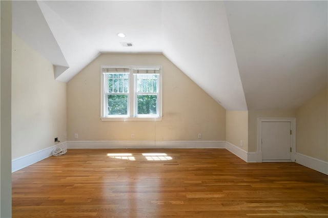 1276 Lanier Blvd NE, Atlanta, GA 30306 - additional living space with wood finished floors, vaulted ceiling, and baseboards