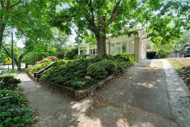 1276 Lanier Blvd NE, Atlanta, GA 30306 - view of property hidden behind natural elements featuring asphalt driveway