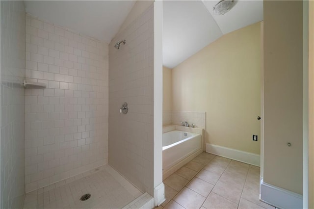 1276 Lanier Blvd NE, Atlanta, GA 30306 - bathroom with vaulted ceiling, a shower stall, tile patterned flooring, a bath, and baseboards