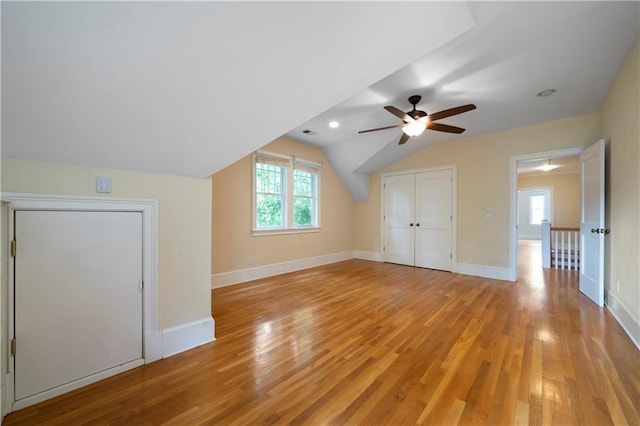 1276 Lanier Blvd NE, Atlanta, GA 30306 - additional living space with light wood-style flooring, ceiling fan, healthy amount of natural light, lofted ceiling, and baseboards
