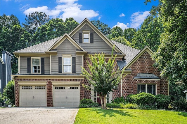 3117 Blowing Wind Ct NW, Acworth, GA 30101 - traditional-style house featuring brick siding, a garage, and a front yard