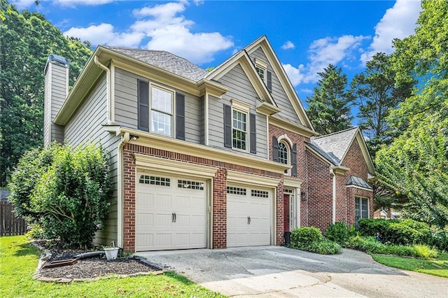 3117 Blowing Wind Ct NW, Acworth, GA 30101 - traditional home featuring a garage, driveway, brick siding, and a chimney
