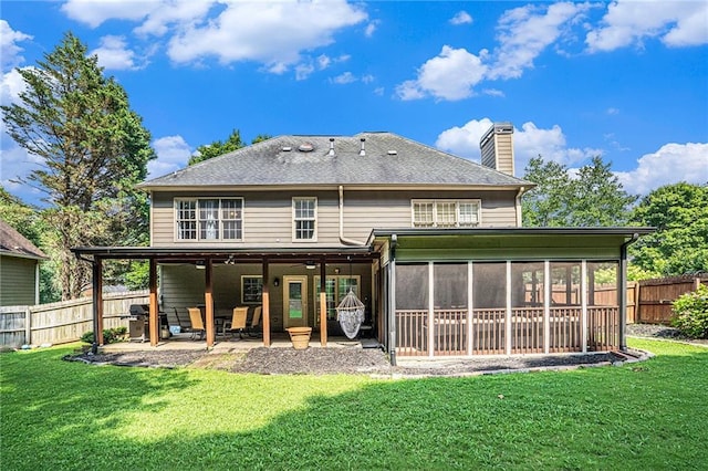 3117 Blowing Wind Ct NW, Acworth, GA 30101 - back of house featuring a patio area, a fenced backyard, a chimney, and a sunroom