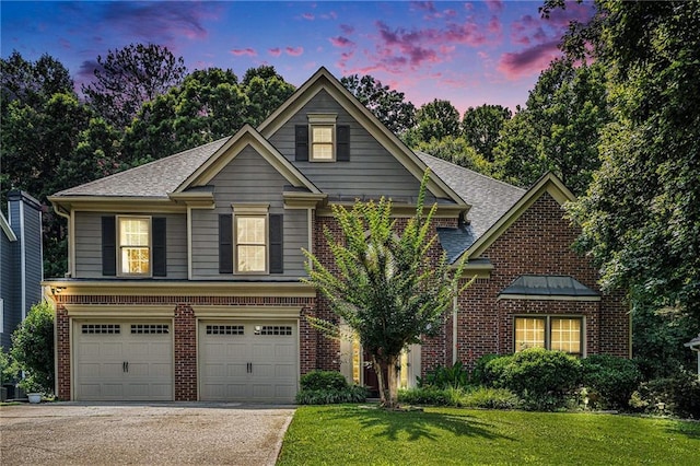 3117 Blowing Wind Ct NW, Acworth, GA 30101 - traditional-style house featuring brick siding, a front lawn, concrete driveway, a garage, and a shingled roof