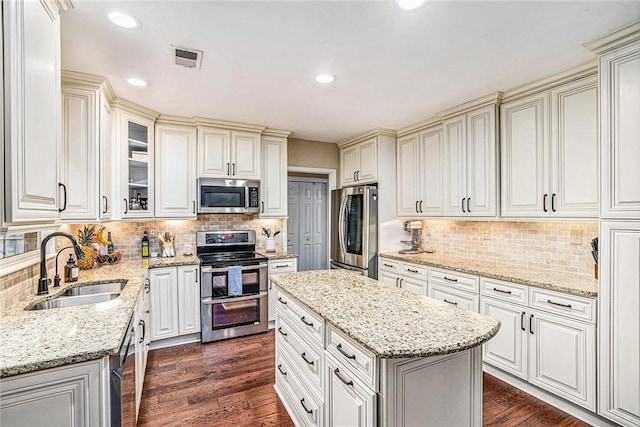 3117 Blowing Wind Ct NW, Acworth, GA 30101 - kitchen with appliances with stainless steel finishes, backsplash, light stone counters, and recessed lighting
