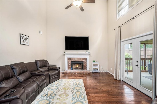 3117 Blowing Wind Ct NW, Acworth, GA 30101 - living room with a high ceiling, a ceiling fan, dark wood-type flooring, plenty of natural light, and french doors