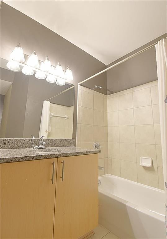 full bathroom featuring shower / bath combo with shower curtain, vanity, and tile patterned flooring