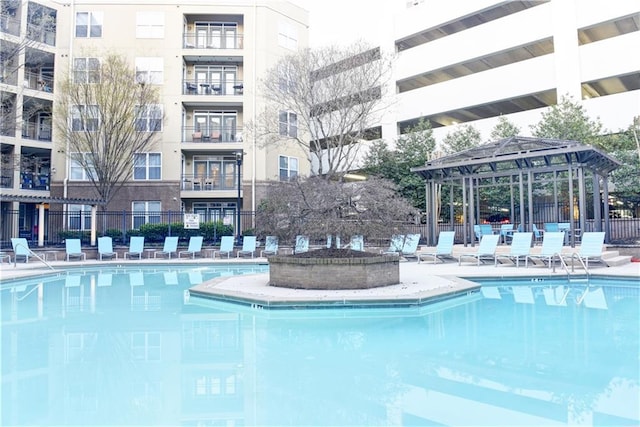 community pool featuring fence