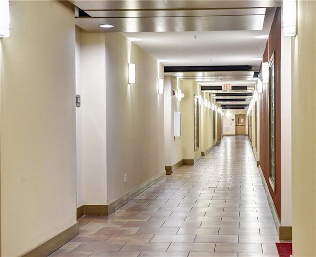 corridor featuring baseboards