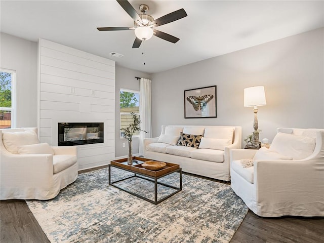 5641 Hislop Ln Unit 88, Mableton, GA 30126 - living room featuring baseboards, visible vents, a ceiling fan, wood finished floors, and a fireplace