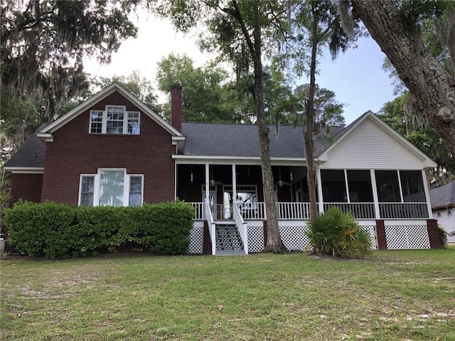 view of front facade with covered porch and a front yard