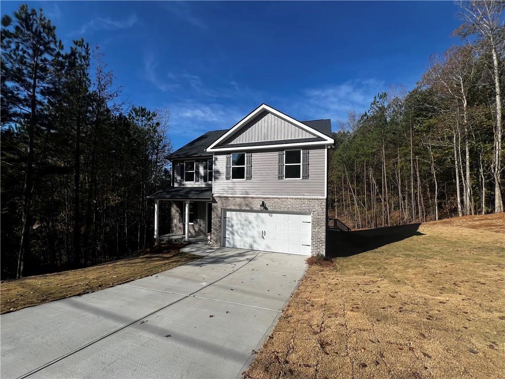 view of front property with a front lawn and a garage