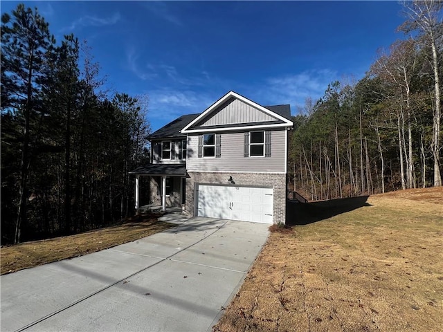 view of front property with a front lawn and a garage