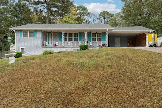 single story home with a front lawn, covered porch, and a carport