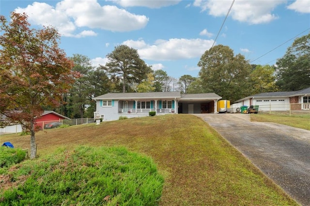 view of front facade with a garage, a front yard, and covered porch