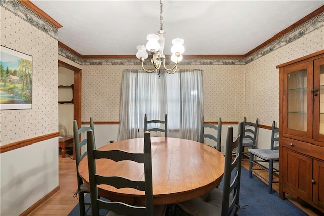 dining area with an inviting chandelier, ornamental molding, and wood-type flooring