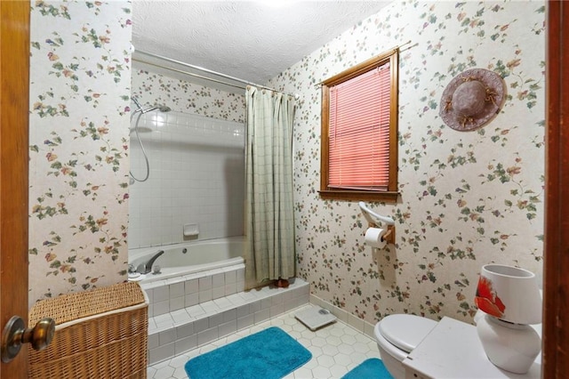 bathroom featuring shower / bath combination with curtain, tile patterned flooring, toilet, and a textured ceiling