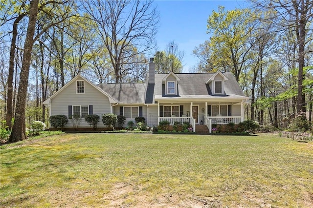 cape cod-style house with a front lawn and covered porch