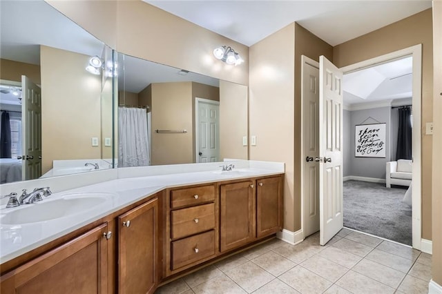 bathroom with tile patterned flooring and vanity