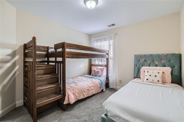 bedroom with dark carpet