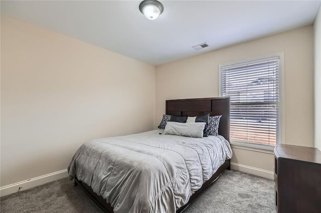 bedroom featuring carpet flooring and multiple windows