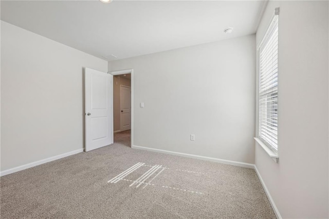 1539 High Falls Ln, Grayson, GA 30017 - spare room featuring healthy amount of natural light, carpet floors, and a smoke detector