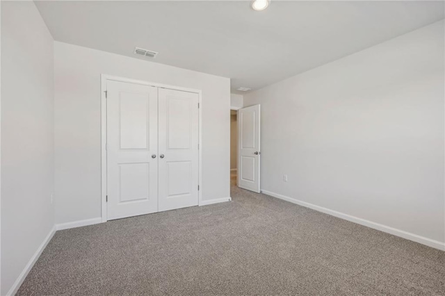 1539 High Falls Ln, Grayson, GA 30017 - unfurnished bedroom with carpet floors, a closet, and recessed lighting