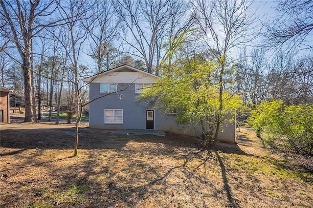 view of side of property with a patio