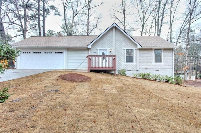 ranch-style home featuring a garage and a front yard