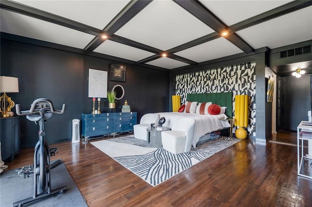 bedroom with coffered ceiling, wood finished floors, and beamed ceiling