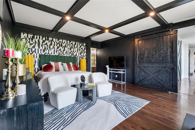 bedroom featuring a barn door, coffered ceiling, wood finished floors, and beamed ceiling