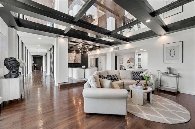 living area featuring wood finished floors, recessed lighting, beamed ceiling, and baseboards