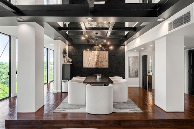 dining room featuring coffered ceiling, wood finished floors, beam ceiling, recessed lighting, and baseboards