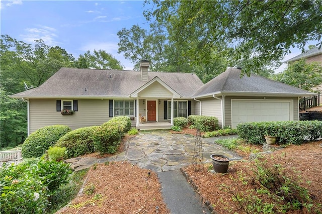 5065 Nesbit Ferry Ln, Atlanta, GA 30350 - single story home with a garage, a chimney, and roof with shingles