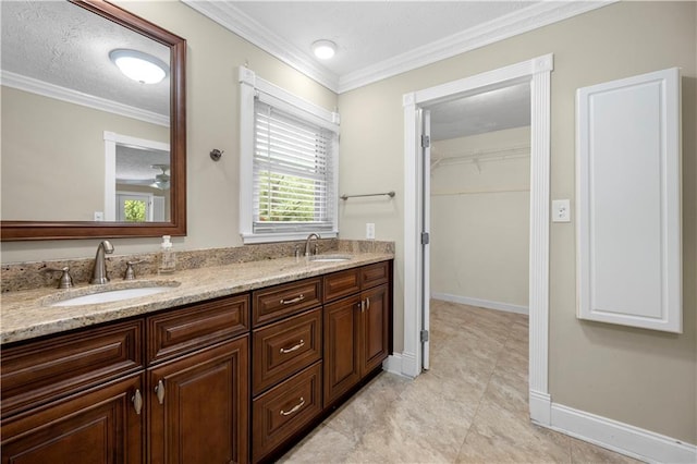 5065 Nesbit Ferry Ln, Atlanta, GA 30350 - full bath featuring double vanity, a walk in closet, ornamental molding, and a textured ceiling