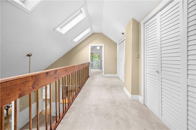 5065 Nesbit Ferry Ln, Atlanta, GA 30350 - hall with a skylight, vaulted ceiling, and light carpet
