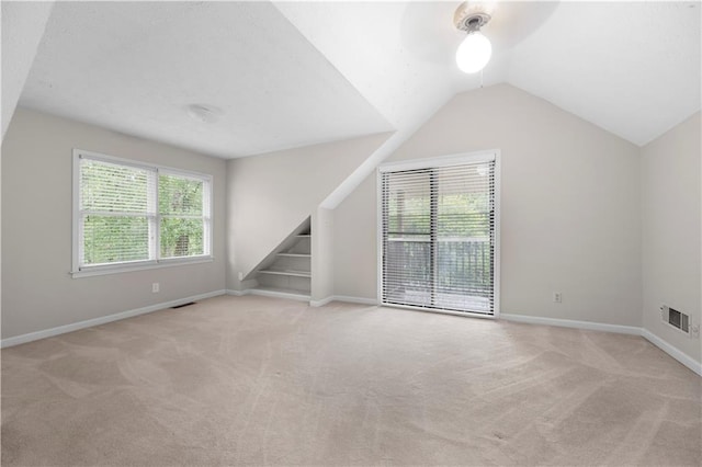 5065 Nesbit Ferry Ln, Atlanta, GA 30350 - carpeted empty room with vaulted ceiling and stairs