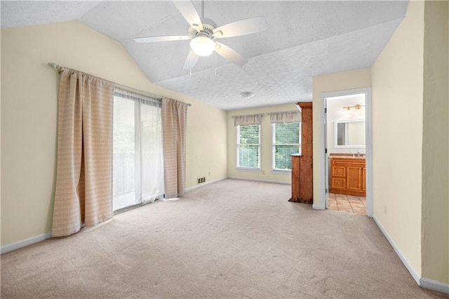 5065 Nesbit Ferry Ln, Atlanta, GA 30350 - unfurnished bedroom with light carpet, lofted ceiling, ensuite bathroom, and ceiling fan
