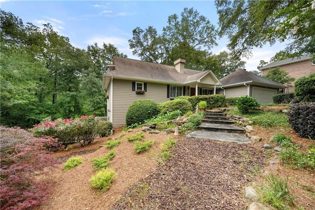 5065 Nesbit Ferry Ln, Atlanta, GA 30350 - ranch-style house with a chimney and a garage