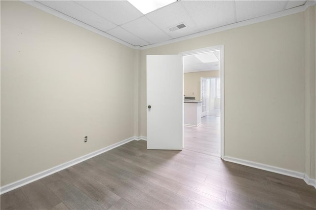 5065 Nesbit Ferry Ln, Atlanta, GA 30350 - empty room featuring wood finished floors and a paneled ceiling