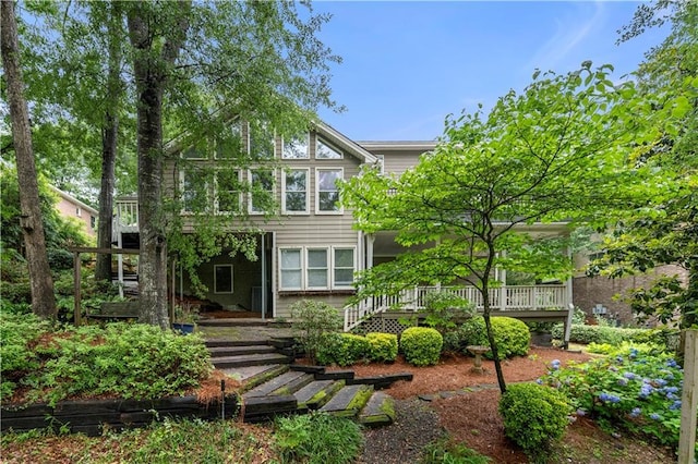 5065 Nesbit Ferry Ln, Atlanta, GA 30350 - rear view of property with a wooden deck
