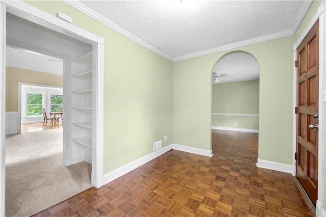 5065 Nesbit Ferry Ln, Atlanta, GA 30350 - unfurnished room featuring ceiling fan, a textured ceiling, ornamental molding, and arched walkways