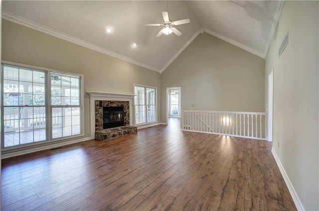 unfurnished living room featuring high vaulted ceiling, dark wood finished floors, visible vents, and crown molding